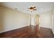 Bedroom with an overhead ceiling fan and wood floors at 6335 Cardinal Crest Dr, New Port Richey, FL 34655