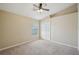 Cozy bedroom features plush carpet and a vaulted ceiling at 6335 Cardinal Crest Dr, New Port Richey, FL 34655