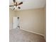 Bright bedroom featuring neutral paint, a ceiling fan, and plush carpeting at 6335 Cardinal Crest Dr, New Port Richey, FL 34655