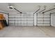 Spacious two-car garage with ample room for parking and storage at 6335 Cardinal Crest Dr, New Port Richey, FL 34655