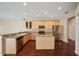 Kitchen features stainless appliances, granite countertops, and wood cabinetry at 6335 Cardinal Crest Dr, New Port Richey, FL 34655