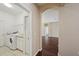 Bright laundry room with white washer, dryer, utility sink, and white cabinets at 6335 Cardinal Crest Dr, New Port Richey, FL 34655