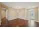 Spacious living room with hardwood floors, modern lighting, and an arched entry at 6335 Cardinal Crest Dr, New Port Richey, FL 34655