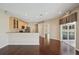 Open living space with kitchen, hardwood floors and view to pool area at 6335 Cardinal Crest Dr, New Port Richey, FL 34655