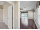 Open-concept living room with ceiling fan and hardwood floors at 6335 Cardinal Crest Dr, New Port Richey, FL 34655