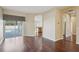 Spacious living room featuring hardwood floors, sliding glass doors to pool, and an open floor plan at 6335 Cardinal Crest Dr, New Port Richey, FL 34655