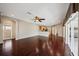 Bright living room features hardwood floors, neutral walls, and a ceiling fan at 6335 Cardinal Crest Dr, New Port Richey, FL 34655