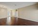 Hardwood floored living room with modern light fixture and arched doorways at 6335 Cardinal Crest Dr, New Port Richey, FL 34655