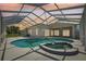 The screened pool and spa offer a great private place to relax and exercise, right outside the back door at 6335 Cardinal Crest Dr, New Port Richey, FL 34655