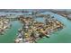 Stunning waterfront neighborhood with private docks and lush landscaping on a sunny day at 1120 81St S St, St Petersburg, FL 33707