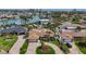 Beautiful single Gathering home with a well-manicured lawn, circular driveway, and mature landscaping at 1120 81St S St, St Petersburg, FL 33707