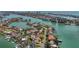 Aerial view of a beautiful waterfront community with homes on canals, boasting boat docks and serene water access at 1120 81St S St, St Petersburg, FL 33707