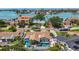 Aerial view of a waterfront home featuring a pool and lush landscaping in a coastal community at 1120 81St S St, St Petersburg, FL 33707
