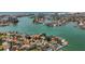 Breathtaking aerial view of waterfront homes nestled along winding canals, offering stunning views of the bay at 1120 81St S St, St Petersburg, FL 33707