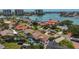A waterfront home boasts a private pool and lush landscaping, complemented by stunning views of the serene water at 1120 81St S St, St Petersburg, FL 33707