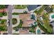 Aerial view of a home highlighting a private pool, mature landscaping, and paver driveway at 1120 81St S St, St Petersburg, FL 33707