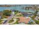 Aerial view of houses with palm trees and water views, neighborhood at 1120 81St S St, St Petersburg, FL 33707