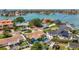 Aerial view showcasing residential homes with lush landscaping, pools, and waterfront views at 1120 81St S St, St Petersburg, FL 33707
