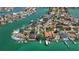 Waterfront homes with boat docks line winding canals in this stunning aerial view of a desirable coastal community at 1120 81St S St, St Petersburg, FL 33707