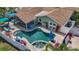 Aerial view of home featuring a custom pool and patio area at 1120 81St S St, St Petersburg, FL 33707