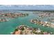 Panoramic aerial view showcases homes on the water's edge with picturesque canals and verdant landscapes at 1120 81St S St, St Petersburg, FL 33707
