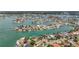 A sprawling waterfront community features homes along tranquil canals with boat docks, providing scenic water access at 1120 81St S St, St Petersburg, FL 33707