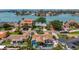 Stunning aerial view of a waterfront home with a private pool, manicured landscaping, and beautiful water views at 1120 81St S St, St Petersburg, FL 33707