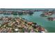 Scenic aerial view of waterfront homes with boat docks nestled along winding canals in a vibrant coastal community at 1120 81St S St, St Petersburg, FL 33707