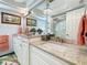 Bathroom featuring granite counters, modern lighting, and decorative rug at 1120 81St S St, St Petersburg, FL 33707