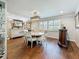 Elegant dining room features a round table, seating for six, and a modern chandelier at 1120 81St S St, St Petersburg, FL 33707