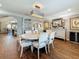 The formal dining room features modern lighting and a glass display cabinet at 1120 81St S St, St Petersburg, FL 33707
