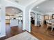 Inviting foyer with archways leading to the kitchen and dining areas and hardwood floors at 1120 81St S St, St Petersburg, FL 33707