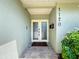 Welcoming facade of home with decorative glass doors and lush landscape elements at 1120 81St S St, St Petersburg, FL 33707