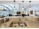 Kitchen sink and granite breakfast bar overlooking the high ceilings and beams in the living space at 1120 81St S St, St Petersburg, FL 33707