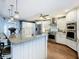 Updated kitchen with a breakfast bar, stainless steel appliances, and modern lighting at 1120 81St S St, St Petersburg, FL 33707
