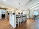 Bright kitchen featuring a large island with bar seating, white cabinets and stainless steel appliances at 1120 81St S St, St Petersburg, FL 33707