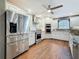Bright kitchen featuring white cabinets, stainless steel appliances, and beautiful wood floors at 1120 81St S St, St Petersburg, FL 33707