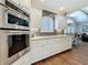 Updated kitchen with a tile backsplash, stainless steel appliances, and recessed lighting at 1120 81St S St, St Petersburg, FL 33707