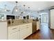 Kitchen island overlooking the living room and vaulted ceilings at 1120 81St S St, St Petersburg, FL 33707