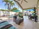 Screened patio featuring wicker furniture and tile flooring at 1120 81St S St, St Petersburg, FL 33707