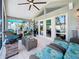 Screened patio featuring wicker furniture and tile flooring at 1120 81St S St, St Petersburg, FL 33707