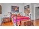 Comfortable bedroom with hardwood floors and stylish decor and art prints at 161 27Th N Ave, St Petersburg, FL 33704