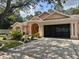 Charming single-story home with a well-manicured lawn and a spacious two-car garage at 7190 Raymond Pl, Spring Hill, FL 34607