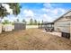Large backyard featuring a storage shed and screened-in pool area at 2204 Krista Ln, Brandon, FL 33511