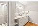 Bathroom features granite counters, white cabinetry, and wood look floors at 2204 Krista Ln, Brandon, FL 33511