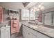 Bathroom boasts granite counters, white cabinetry, and ample storage at 2204 Krista Ln, Brandon, FL 33511