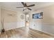 Dining room with wood-look flooring, white trim, and decorative wall art at 2204 Krista Ln, Brandon, FL 33511
