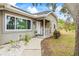 Inviting front porch with stone accents and a cozy walkway at 2204 Krista Ln, Brandon, FL 33511