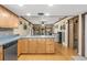 Kitchen featuring stainless steel appliances, light wood cabinets, tile floors, and an open design at 2204 Krista Ln, Brandon, FL 33511