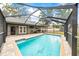 Gorgeous swimming pool with a screened-in enclosure and backyard shed at 2204 Krista Ln, Brandon, FL 33511